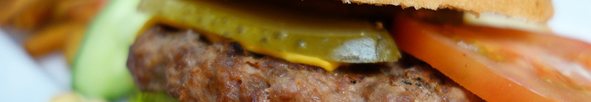 Eating Burger Greek Sandwich at Gyro On Pita restaurant in Ridgefield, CT.